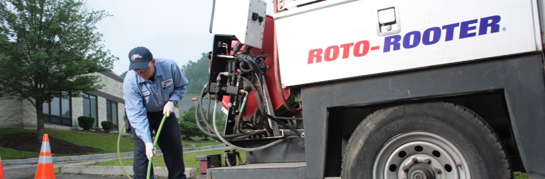 A Roto-Rooter team member working on a storm drain