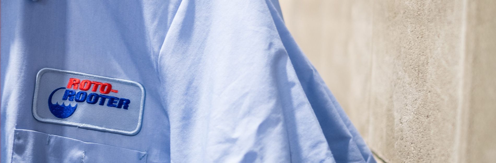 Blue Roto Rooter shirt with embroidered logo